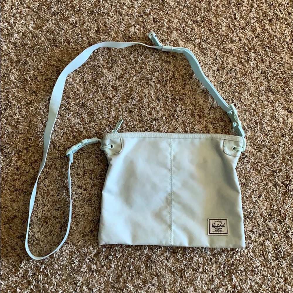 Blue herschel crosbody bag